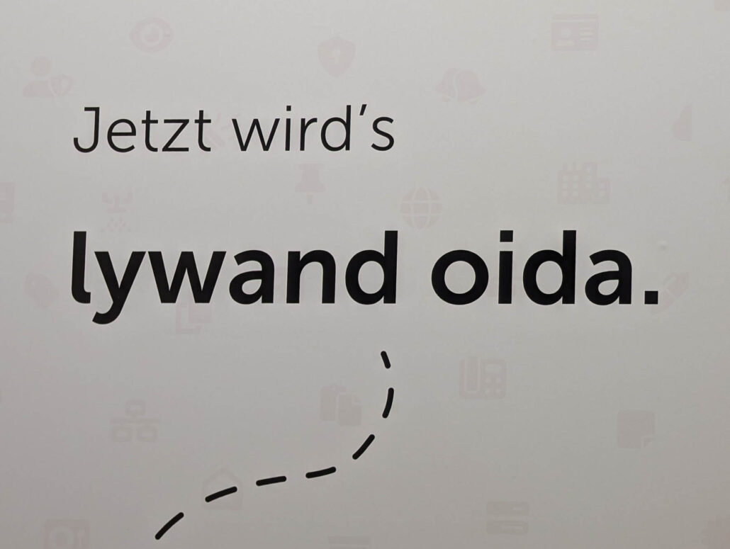 Messestandbeschriftung: "Jetzt wird's lywand oida."